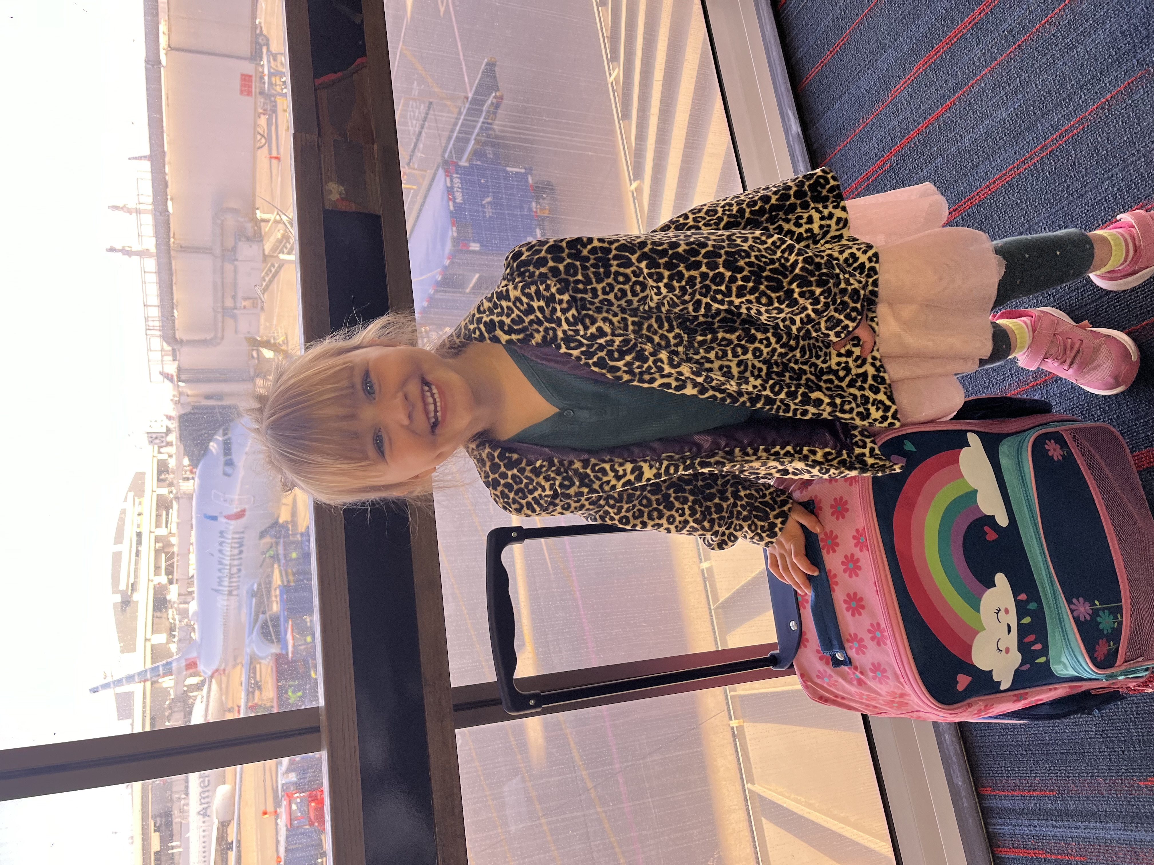 Travel nanny assisting family at vacation